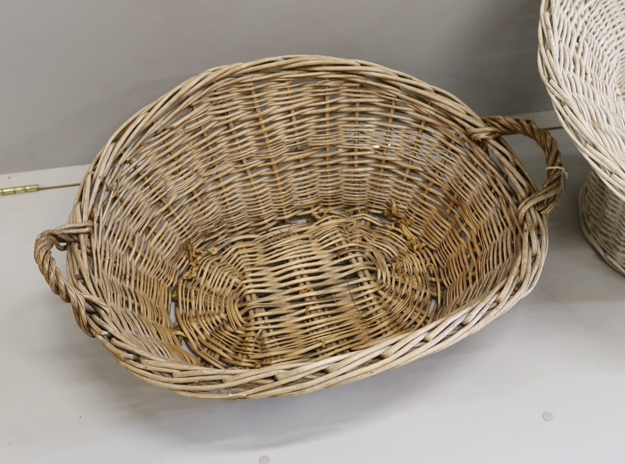 Two large wicker baskets, larger height 86cm